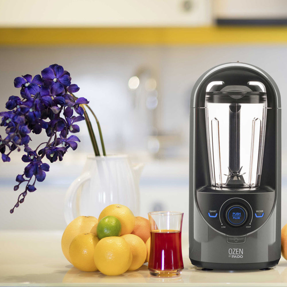 Pado Ozen blender on a kitchen counter with fresh fruits and purple flowers