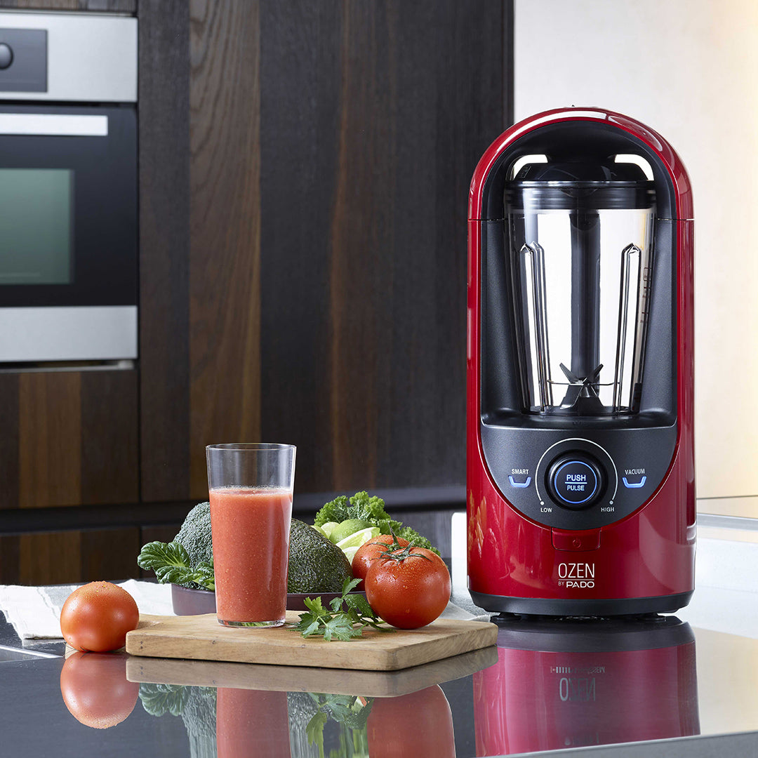 Pado Ozen blender on a kitchen counter with fresh vegetables