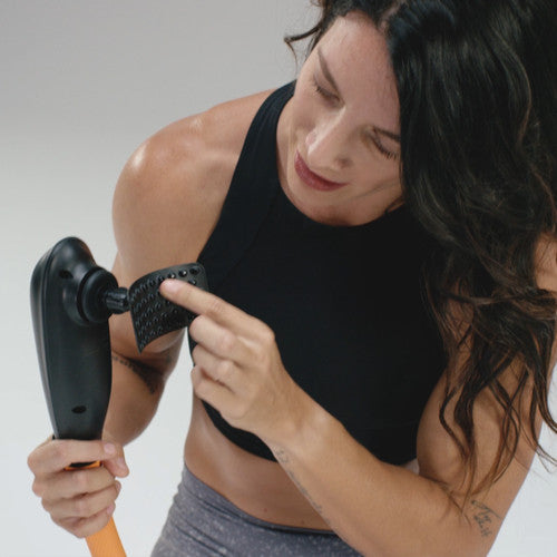 woman pointing to purewave cmx massager 3d-pivot attachment